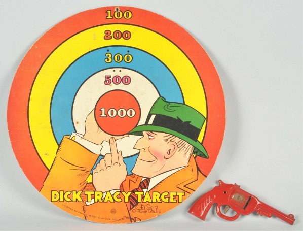 Dick Tracy Target & Gun.: Description 1950s. Missing darts with rubber stoppers, otherwise complete. Overall soiling, a few small nail holes, minor marks, and nicks. Condition (Very Good). Size 17 - 1/4" Dia.