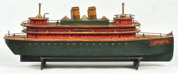 Wooden Liberty Ocean Liner Wind-Up Toy.: Description Marked "Libertania" on front. Original flags and masts. This is one of the scarcer boats in the Liberty Boat series. Condition (Very Good - Excellent). Size 28" L.