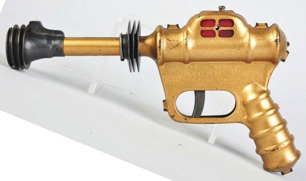 Daisy Buck Rogers Atomic Pistol Toy.: Description Gold version. Some scratching and wear. Condition (Very Good). Size 10 - 1/2" L.