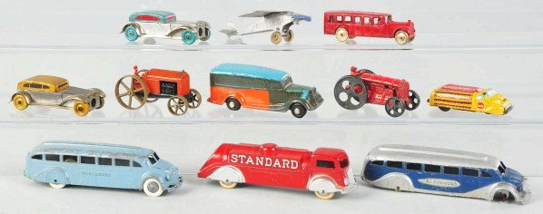Lot of 11: Diecast & Tin Vehicle Toys.: Description Includes small Coca-Cola truck, Tootsietoy tractor, and others. Various conditions. Condition (Very Good). Size Largest: 6" L.