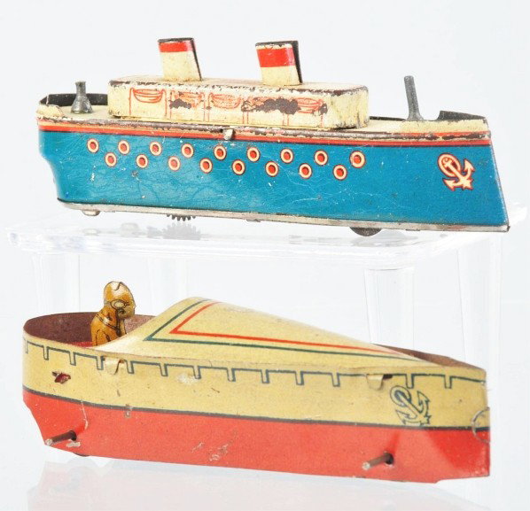 Lot of 2: Tin Litho Boat Penny Toys.: Description German. Includes one speed boat with removable lithographed driver and one wind-up two-stack ocean liner with spots of litho loss on both sides. Condition (Good - Very Good). Size Largest: