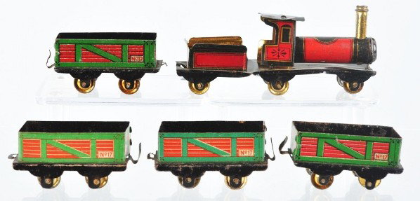 Tin Litho Freight Train Set Penny Toy.: Description German. Includes steam engine tender combination and four no. 17 freight cars. Gold wash wheels. Some denting to engine and tender and overall wear to cars. Condition (Good - Very Good). S