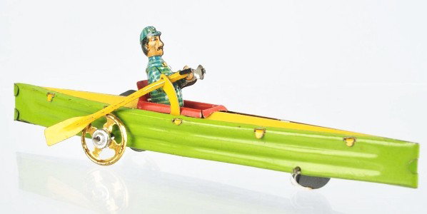 Tin Litho Rowboat Penny Toy.: Description German. Original oars. Rower is articulated. One of the scarcer boat toys. Some scratching to figure. Condition (Very Good). Size 6 - 1/2" L.