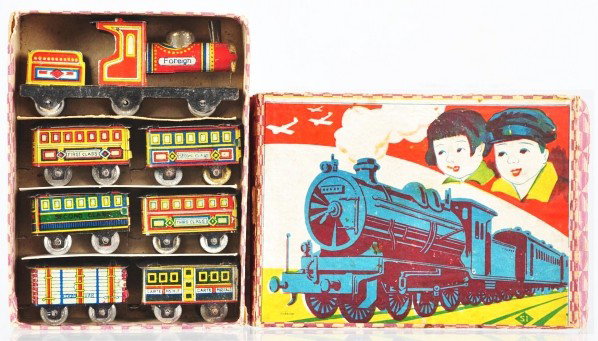 Tin Litho Train Set Penny Toy.: Description Japanese. Train is marked "Foreign". Includes steam engine and tender combination on platform along with six passenger cars. Includes original box with nice color lithography and marked "M