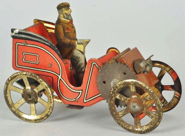 Tin Litho Hess Automobile Wind-Up Toy.: Description German. Working. Marked "151" on rear. Unusual flat litho driver. Gold wash wheels have significant wear. Condition (Very Good). Size 4 - 1/2" L.