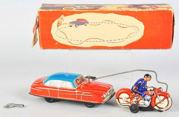 Tin Litho Motorcycle & Toy Wind-Up Toy.: Description German. Working. Marked "Made in US Zone Germany". Some minor scratching and wear. Includes original box with some creasing and wear. Condition (Very Good). Size 9 - 3/4" L.