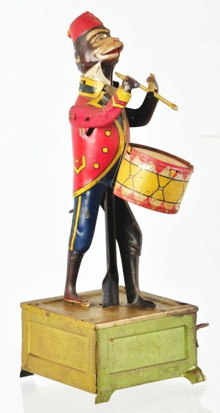 Tin Litho Monkey Drumming Wind-Up Toy.: Description German. Original drumsticks. Monkey missing tassel on back of head and rust around key hole. Condition (Good - Very Good). Size 8" T.