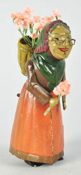 Handpainted Tin Woman Figure Wind-Up Toy.: Description German. Marked "DRGM" on front of dress. Toy has been professionally restored. Condition (Restored). Size 6" T.