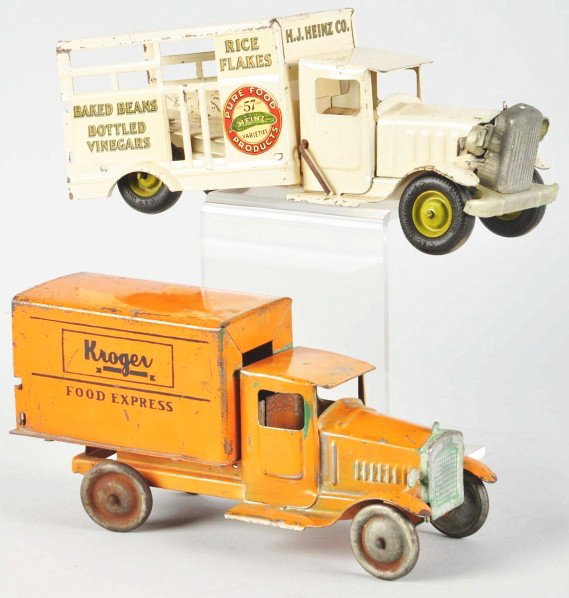 Lot of 2: Pressed Steel Metalcraft Truck Toys.: Description American. Includes one Kroeger Food Express truck and one Heinz Pickle truck missing back tailgate, spare tire, and hook. Decals are good. Some scratching and wear overall, especially to h