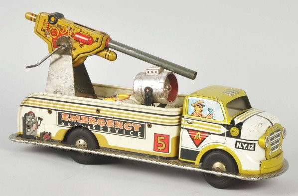 Tin Marx Emergency Service Truck Friction Toy.: Description American. Working. Scarce variation with military gun mounted to rear of truck. Possibly a prototype. Some minor scratching and wear. Condition (Very Good). Size 14 - 1/2" L.