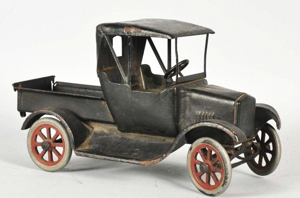 Pressed Steel Buddy L Flivver Toy.: Description American. Dump pick-up has overpaint throughout. Some pitting throughout. Condition (Good - Very Good). Size 12 - 1/2" L.