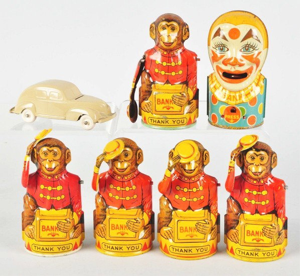 Lot of 7: Tin Litho Mechanical Banks.: Description American. Includes five Chein monkeys with top hats, one missing arm and top hat, one Chein clown, and one Straits automobile. Condition (Very Good). Size Largest: 5 - 1/4" T.