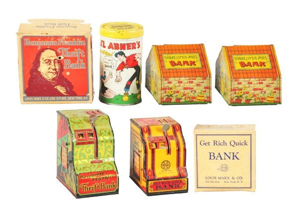 Lot of 5: Tin Litho Still Banks.: Description American. Includes one Marx Get Rich Quick in original box, one Marx Ben Franklin bank in original box, one Lil' Abner, and two Chein Three Little Pigs banks. Condition (Very Good). Size L