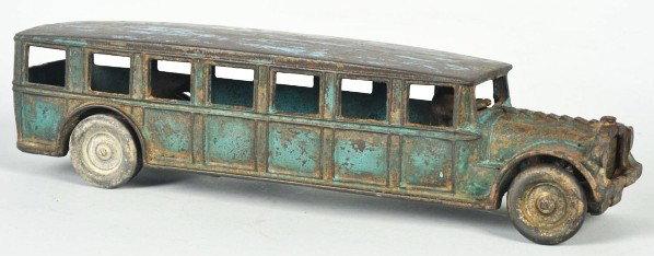 Cast Iron Arcade Fageol Bus Toy.: Description American. Original driver. Moderate to heavy paint loss throughout. Condition (Very Good). Size 12 - 1/2" L.