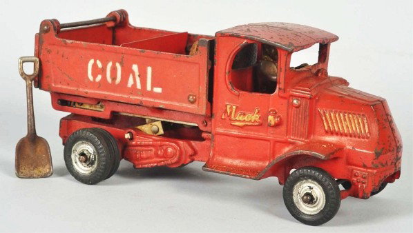 Cast Iron Arcade Mack Coal Truck Toy.: Description American. Later version scissors dump with black rubber tires. Includes original metal divider and shovel. Embossed "Mack" on doors. Some overall wear. Condition (Very Good). Size 10" L.