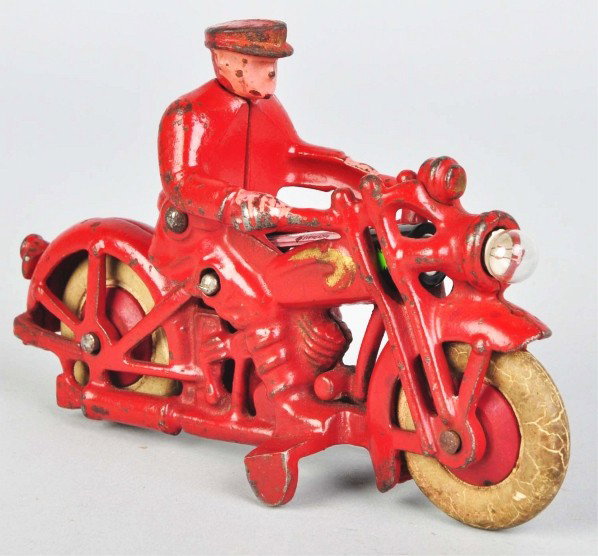 Cast Iron Hubley Motorcycle Toy.: Description American. Civilian rider, white rubber tires, and battery-operated headlight. Some minor to moderate paint loss and wear. Condition (Very Good). Size 6" L.