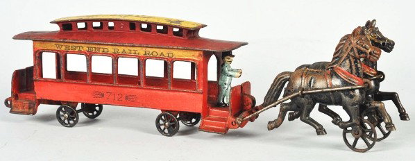 Cast Iron Horse-Drawn Pratt & Letchworth Trolley.: Description American. Includes two articulated horses and driver. Marked "West End Rail Road 712" on both sides of trolley. Some paint loss to horses and top of roof. Condition (Very Good - Excellent)