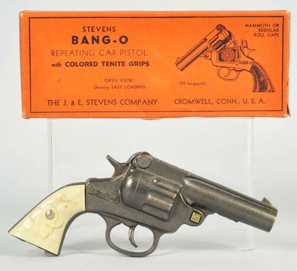 Stevens Bang-O Repeating Toy Cap Gun.: Description Gun is unfired with slight soiling to grips. Includes original box. Condition (Near Mint). Size 7" L.