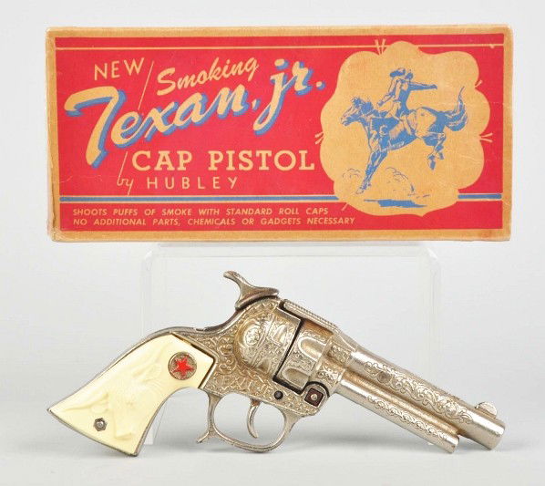 Cast Iron Hubley Texan Jr. Toy Cap Gun.: Description The gun has been fired. Includes original box. Condition Toy (Near Mint) Box (Excellent). Size 8 - 1/2" L.