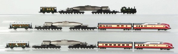 Lot of 11: Various Trix HO Train Items.: Description German. Includes diesel engines, one steam-type engine, five passenger cars, and three Krupp missile cars. Includes several original boxes. Condition (Very Good).