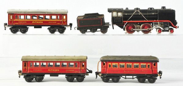Marklin O-Gauge Passenger Train Set.: Description German. Five-piece set include electric type engine, six-wheel tender, and three Mitropa cars, one marked "Schlafwagen" and two "Speisewagen". This is a mismatched set with only minor scra