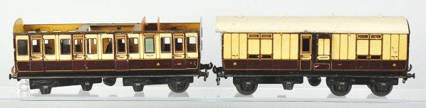 Lot of 2: Carette 1-Gauge Passenger Train Cars.: Description German. One car is marked "132-22" and the other "133-22". One is missing its roof and six wheels and the other is missing two wheels. Cars have some denting to sides and roof. Condition (