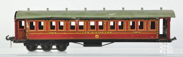Carette 1-Gauge Passenger Train Car.: Description German. Marked "LMS Dining Car 13210". Missing one truck and six wheels. Some scratching on side and roof and some denting and bending throughout. Condition (Good - Very Good).