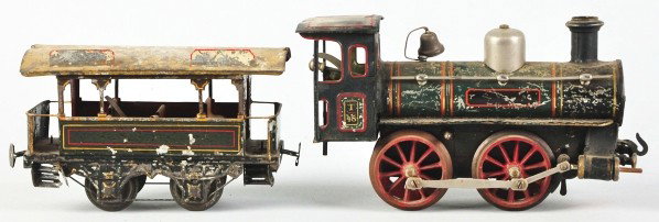 Carette 1-Gauge Clockwork Train Engine & Car.: Description German. Tender is not included. Engine and car have significant wear with one step missing from car and considerable flaking to handpainted roof. Two letter boards are also missing from th