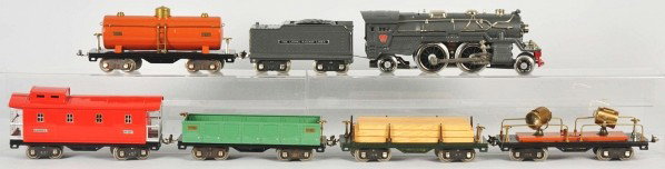 Lionel Standard Gauge No. 385 Freight Train Set.: Description Includes no. 385 steam-type locomotive and tender with nickel trim, one lumber car, one searchlight car, one gondola car, one tank car, and one caboose. Entire set has been professionally 