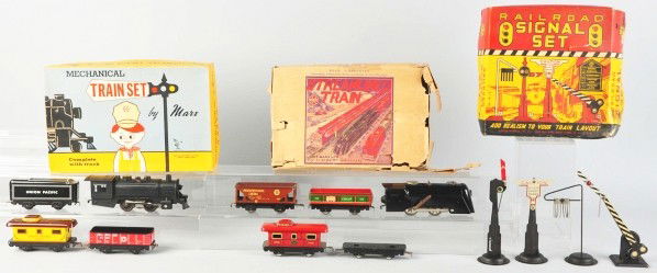 Lot of 3: Tin Marx Train Sets.: Description American. Two sets are wind-up steam freight sets and one is a railroad signal set. Includes all original boxes with some tearing and creasing. Condition (Very Good).