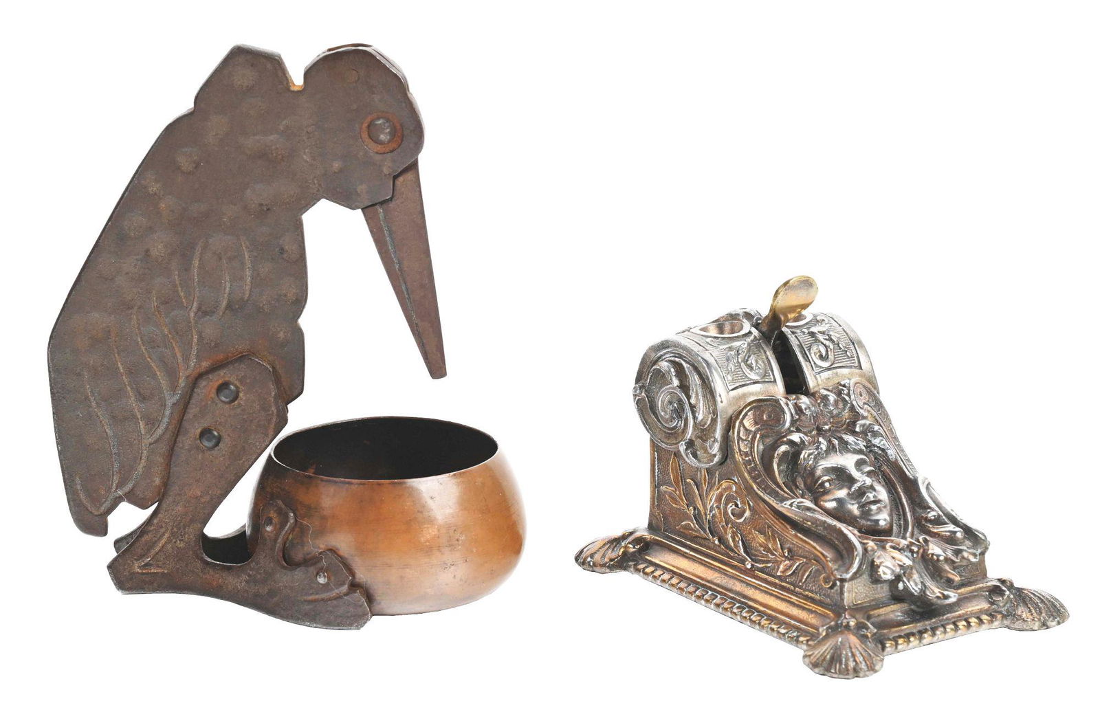 LOT OF 2: CIGAR CUTTERS.: (A) Small cast iron cigar cutter with a great patina. Pushing the lever down reveals spot for cutting cigars. Pretty girl face in the middle. CONDITION: Free of chips, breaks and cracks. (B) Cast iron