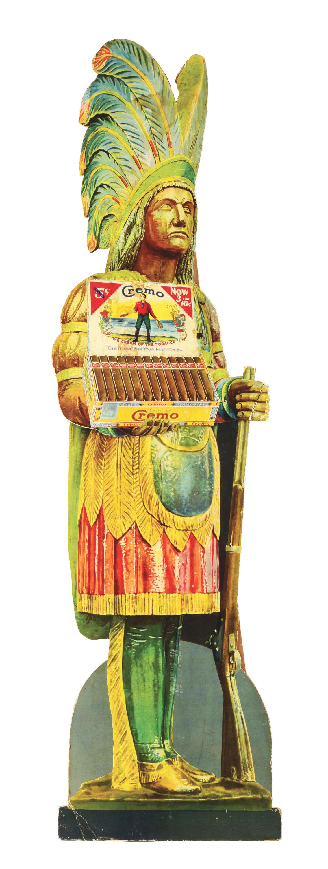 CREMO CIGARS DIE-CUT CARDBOARD EASEL BACK POINT OF SALE DISPLAY W/ NATIVE AMERICAN GRAPHIC.: C. 1930's Cremo Tobacco Native American easel back display. CONDITION: Display shows minor areas of fade throughout the paint, as well as, water damage in the cigar box graphic and headdress. The card