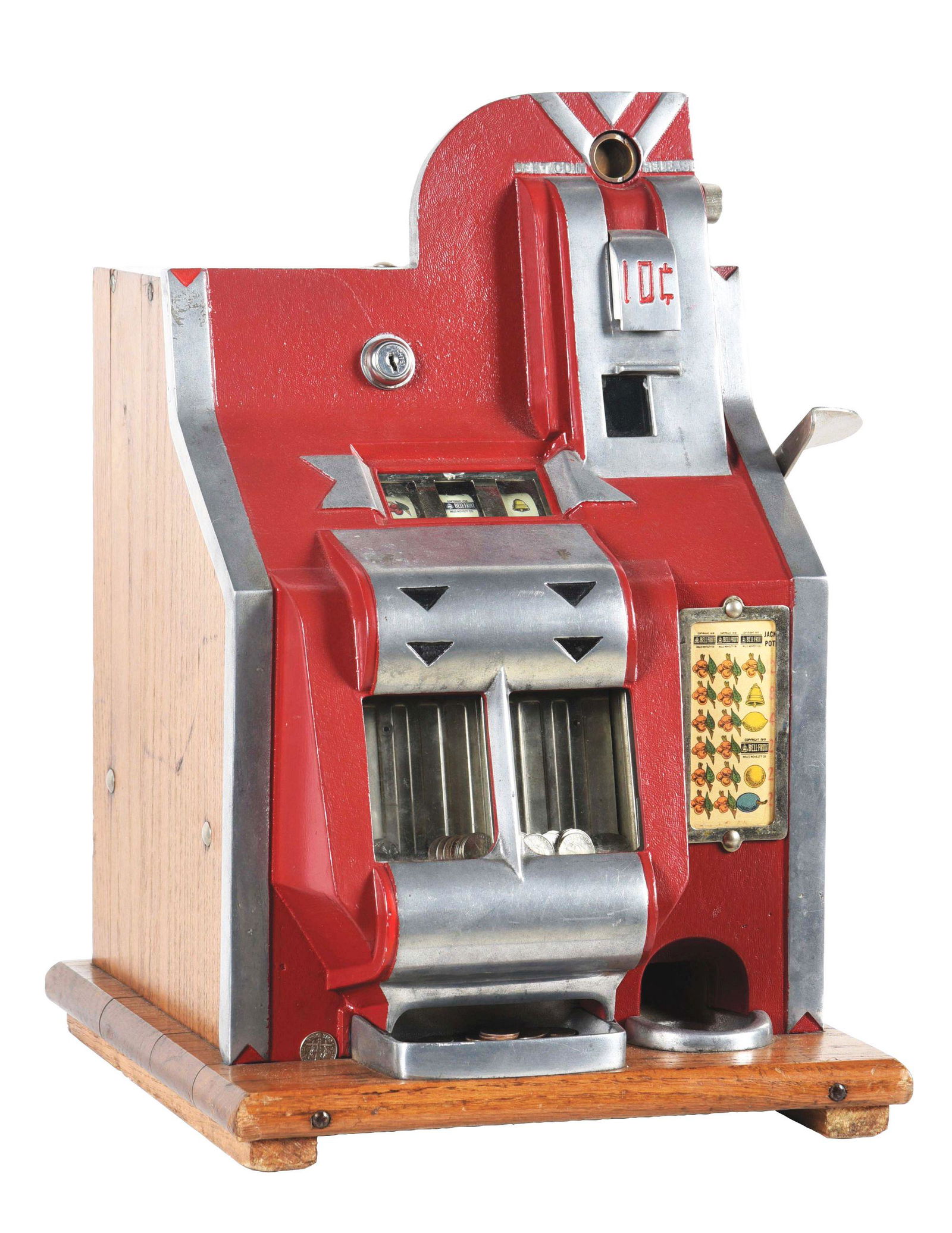 10¢ MILLS QT CHEVRON SLOT MACHINE.: Manufactured by Mills in 1936, featuring a small die-cast aluminum front, in colors of red with silver matte details. There is a double jackpot reserve, with original reel strips and back door with re