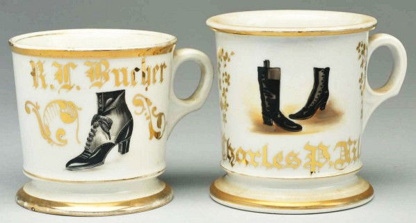 Lot of 2: Shoe Salesman Shaving Mugs.: Description Includes one gilded "R.C. Bucher" with a beautiful image of a high heeled shoe and one gilded "Charles P. Niles" depicting a pair of boots. Condition (Excellent Plus). Size Largest: 4" T.