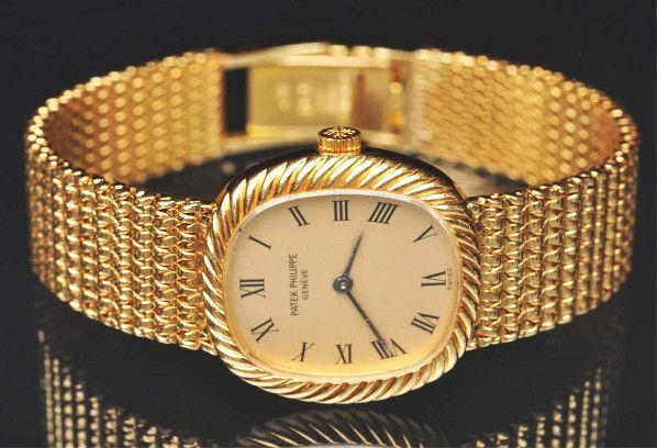 18K Patek Philippe Ladies Wrist Watch.: Description With attached band. 18 jewel. Manual wind. Reference # 4461/1. Serial # 2776446. Runs beautifully. Condition (Excellent).