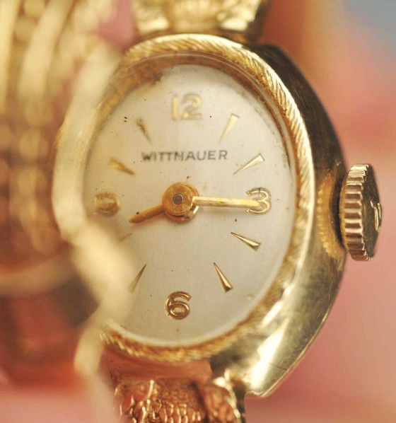 14K Wittnauer Watch Co. Watch.: Description Swiss-made. 17 jewel. With flip over and attached band. 10 to 11 dwt. Condition (Excellent).