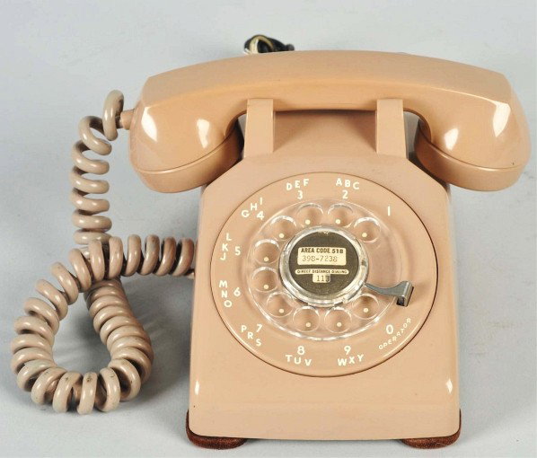 Western Electric Dark Beige 500 Cradle Telephone.: Description Soft plastic, shell marked 11A and dated 1956, base dated 1956, no cracks, and early gray receiver cord. Condition (Excellent). Size 9" L.