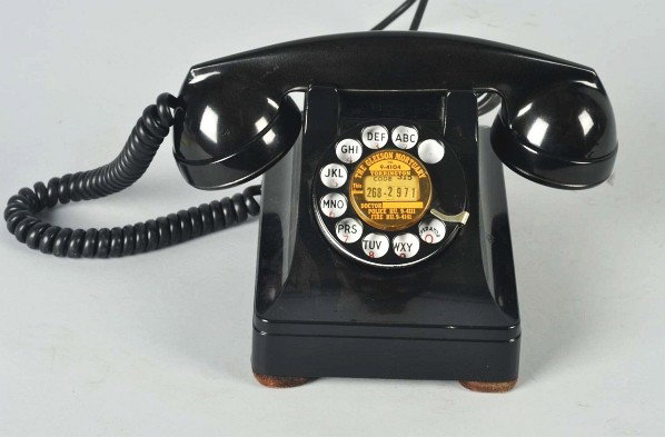 Western Electric 302 Cradle Telephone with Vents.: Description Circa 1937. Black metal. Vents, small plungers, F1 handset, 6H dial with number card advertising The Gleeson Mortuary, Torrington. 302E/G printed on base plate. Condition (Excellent). Size