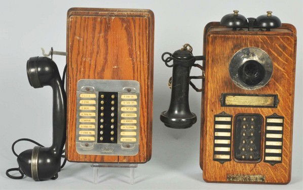 Lot of 2: Wood Wall Intercoms.: Description Circa 1930. First is an oak Stromberg Carlson 12-station intercom with marked receiver, missing screw on tips for station selectors. Second is an oak Couch 16-station intercom with marked