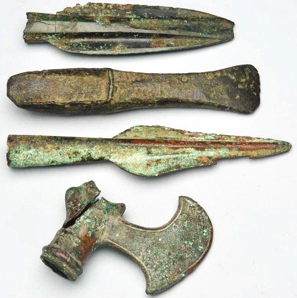 Lot of 4: Bronze Weapon Heads.: Description All four pieces are in the style of the Bronze Age and each piece is heavily crusted with verdigris. Battle axe head is badly damaged. The part that slides off the handle is severely crack