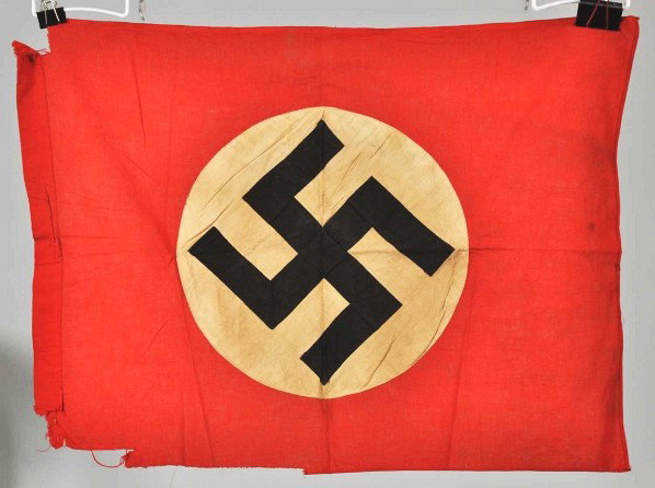 Lot of 5: German Nazi Military Flags.: Description Two small vehicle identification flags. Size 28' x 21'. Podium banner with fringe. Size 41' x 28'. Hall banner with three metal ring loops on the reverse side. Banner has fringe at bottom.