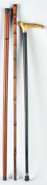 Lot of 3: Antique Walking Stick Canes.: Description Includes one mechanical cane with vial in top, one with antler or horn top, and one mechanical cane with sword in top. Condition (Excellent). Size Largest: 35 - 1/2" L.