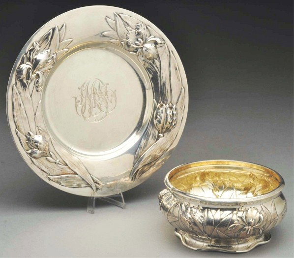 An American Silver Child's Bowl and Plate.: Description Black Starr & Frost. Circular, the sides of the low bowl and broad rim of the plate chased and embossed with long leaves and flowers; engraved inscription under base of both. Signs of ligh