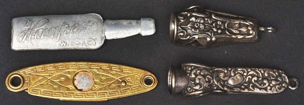 Lot of 4: Cigar Cutters.: Description Includes two in sterling that are ornately embossed, one in the form of a bottle marked "Harper Whiskey", and one in brass. Condition (Excellent). Size Largest: 2 - 1/4" L.