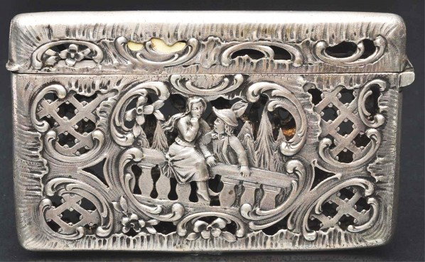 Victorian Calling Card Case.: Description Sterling silver with open lattice work. Depicts a boy and girl sitting on bridge. Condition (Excellent). Size 4" L.