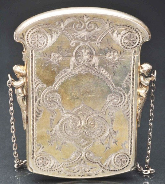Victorian Calling Card Case.: Description Highly engraved sterling silver. Depicts two cherubs on sides to hold chain. Condition (Excellent). Size 4" T.