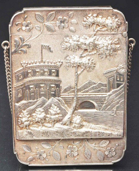 Victorian Calling Card Case with Chain.: Description Sterling silver. Embossed castle scene on both sides. Initials "EW". Condition (Excellent). Size 3 - 1/2" T.