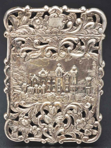 Victorian Calling Card Case.: Description Hallmarked sterling silver. Depicts castle scenes on both sides with open lattice work. Comes with original box. Condition (Excellent). Size 3 - 1/2" T.