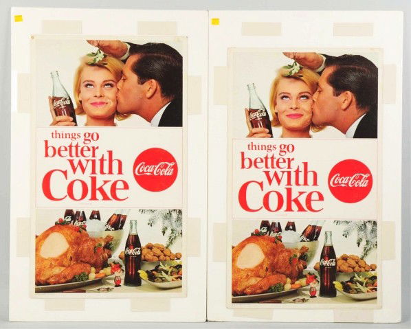 Lot of 4: Cardboard Coca-Cola Posters.: 1960s. Three are the same, featuring a couple kissing with mistletoe. Only light to moderate wear or soiling to those three posters. The fourth poster, featuring a bottle and bell, has more advanced w