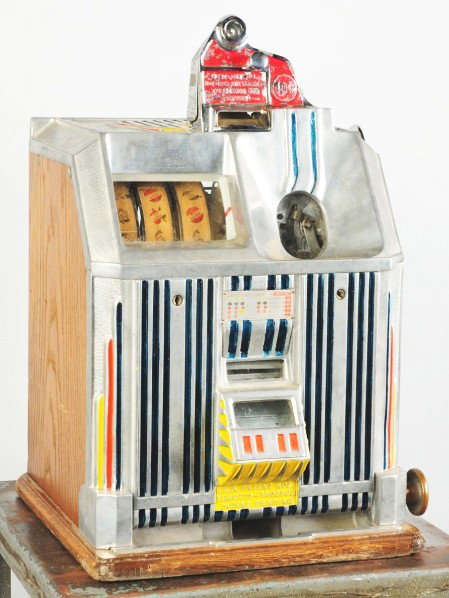 Jennings 10¢ Dutchess Coin-Op Machine.: Missing lock of back of coin head and back door. Two chips in upper casting. Not working. Condition (Fair). Size 23" T.